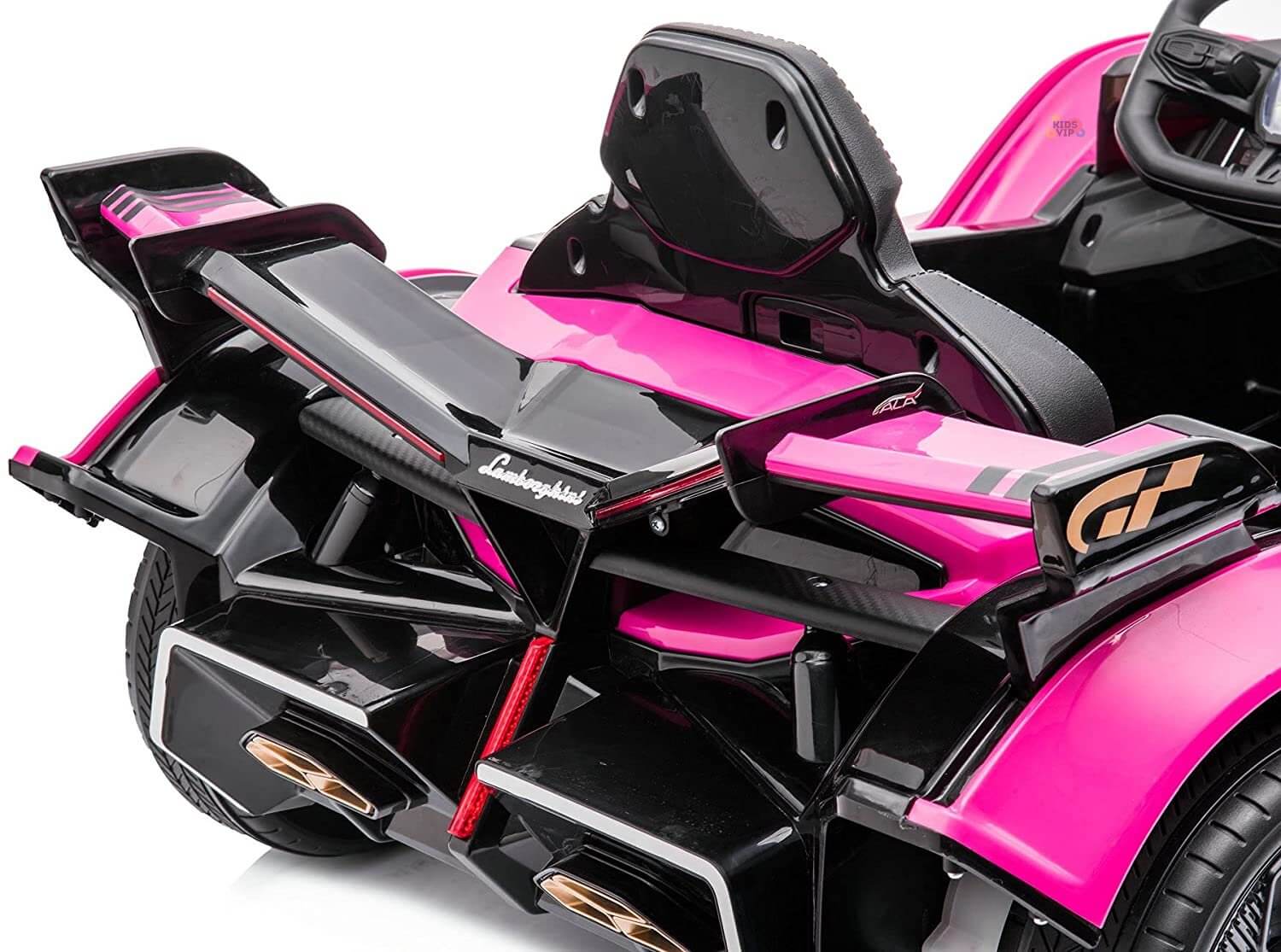 A close-up of the rear of a Pink 12V Official Lamborghini Vision GT Kids Ride-On Car reveals its black spoiler and intricate details. The visible interior seat and steering add to its sleek, sporty look.
