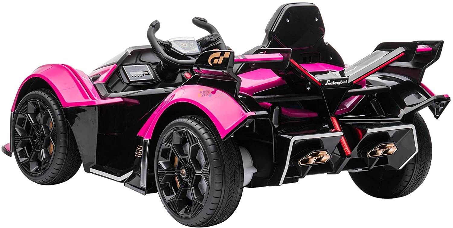 The Pink 12V Official Lamborghini Vision GT Kids Ride-On Car features a sleek design with detailed seats, steering wheel, dashboard, and large wheels. It resembles a Lamborghini Vision GT with an aerodynamic build, visible exhaust, and rear lights.