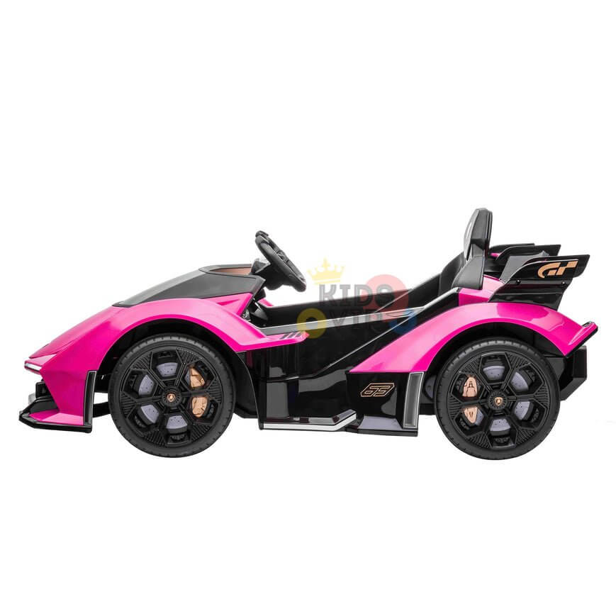 The Pink 12V Official Lamborghini Vision GT Kids Ride-on car features a sleek, sporty design with large black wheels and a racing-style spoiler. It includes a steering wheel and visible side decals to enhance the authentic driving experience.