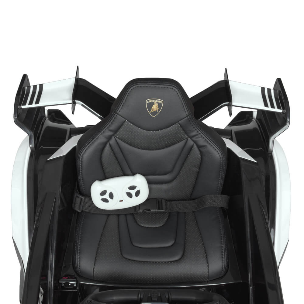 Blue Lamborghini Vision GT ride-on with eco leather harness and white gaming remote. Features a sporty design with visible rear wings. Official Complete Edition 12V for kids.