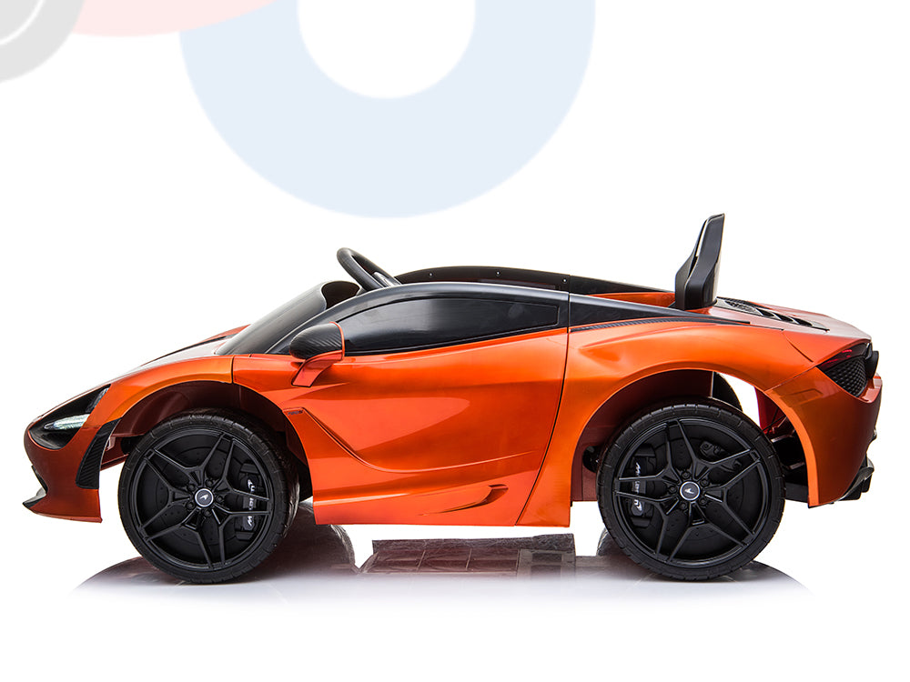 An Orange 12V McLaren 720S Kids Licensed 1 Seater Ride On Car with rubber wheels and remote features a sleek convertible design, shiny orange finish with black accents, visible side mirrors, and detailed wheels against a white backdrop.