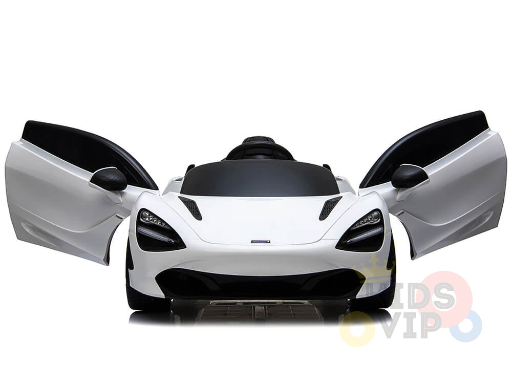 A white 12V McLaren 720S Kids Licensed 1 Seater Ride On Car features rubber wheels and remote control, with butterfly doors open, highlighting its front-view sleek design. This toy includes upgraded features and realistic details for an immersive driving experience.