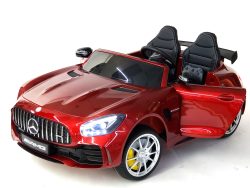 A stunning ride-on car inspired by a Mercedes-Benz AMG, featuring a sleek design, open door, black racing seats, and shiny silver wheels with LED headlights. The 2 Front Gears of the Mercedes GTR-2 Seat enhance the driving experience and ignite your childs imagination.