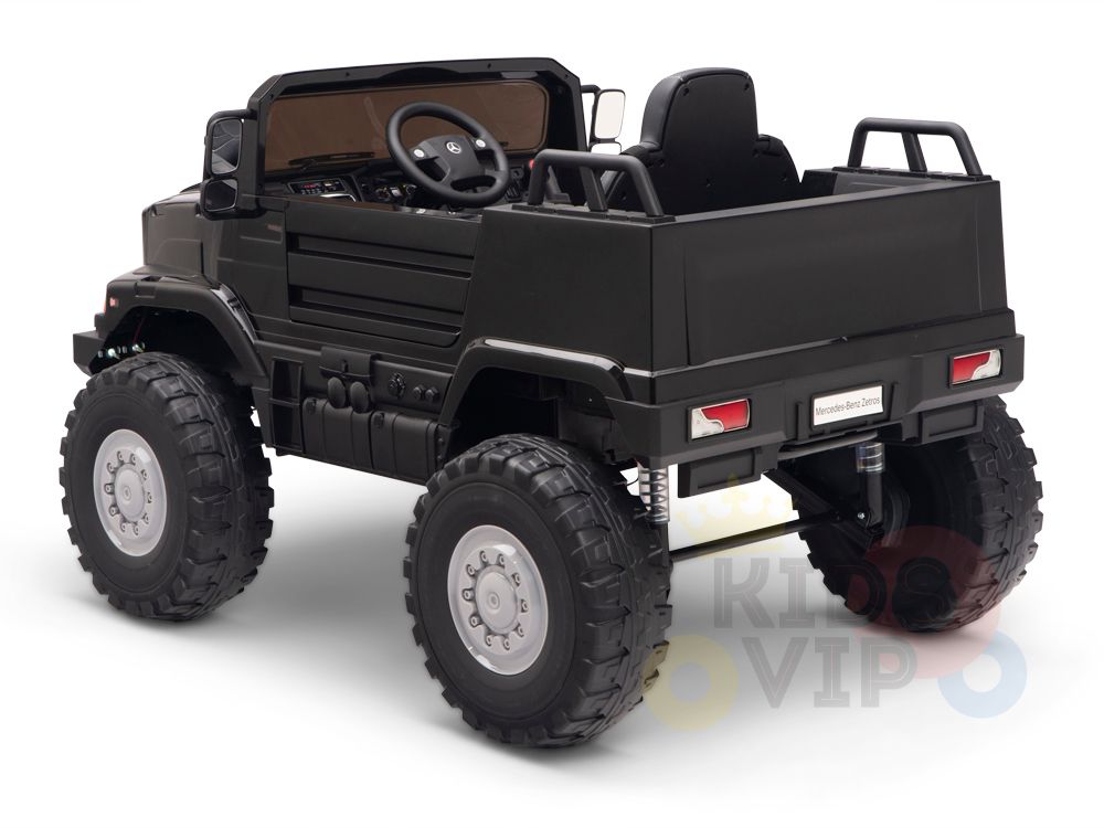 Set against a white background, the Black 12V Mercedes Benz Zetros Kids 1 Seater Ride On Truck features rubber wheels, detailed dashboard, and open seating. Designed to mimic a rugged off-road truck with an adventurous spirit, it includes a remote control for added maneuverability.