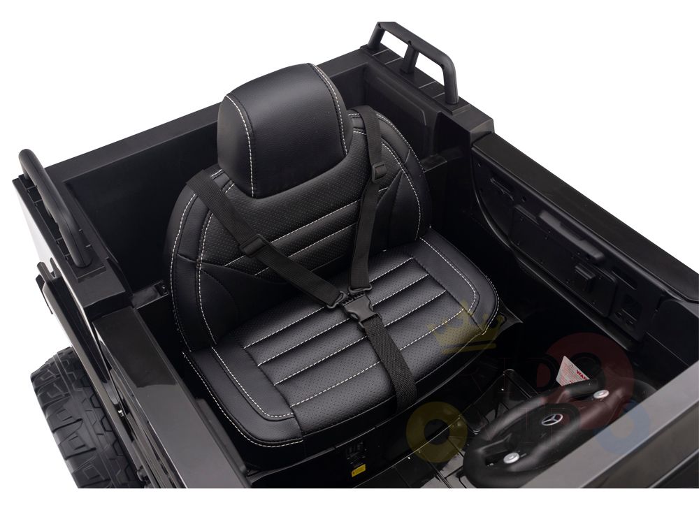 The Black 12V Mercedes Benz Zetros Kids Ride On Truck features a leather seat with white stitching and seatbelt, echoing the real design. With a steering wheel and powerful 12V battery, it ensures hours of fun adventure.