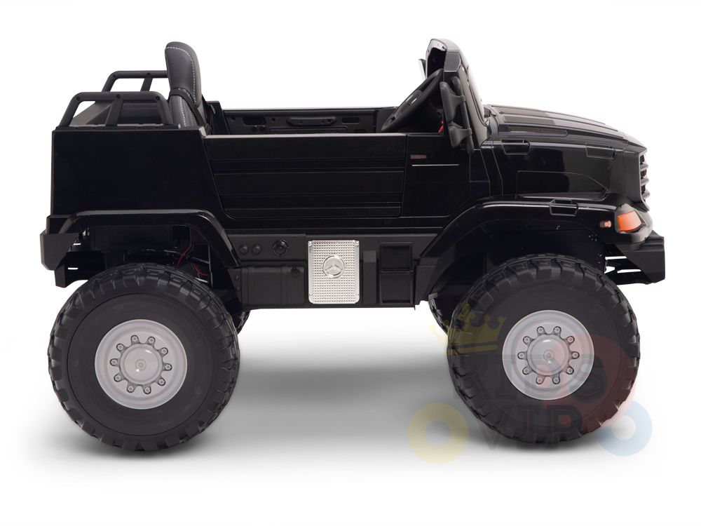 The Black 12V Mercedes Benz Zetros Kids 1 Seater Ride On Truck features an open-top design and rubber wheels. Its powered by a robust battery for adventurous rides, shown side view on a plain white background.