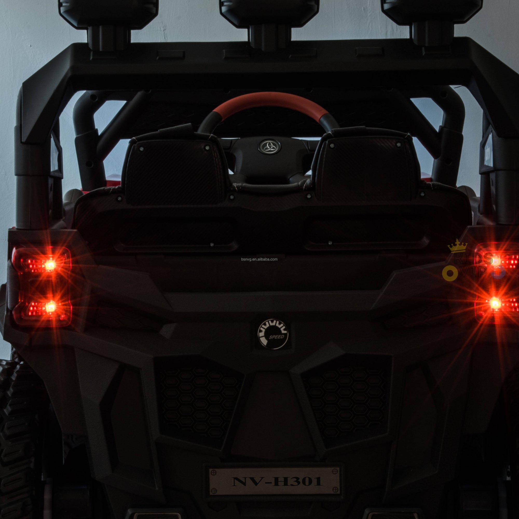 The rear view of the Upgraded 12V Junior Sport Utility Ride On Buggy/UTV 4WD Edition shows visible red taillights and a NV-H301 plate. It features a steering wheel, two seats, and its upgraded details are accentuated by low lighting.