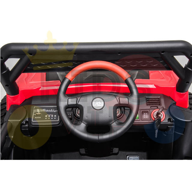 The Upgraded 12V Junior Sport Utility Ride On Buggy/UTV 4WD Edition features an interior with a red steering wheel, dashboard with gear shift, and control buttons. Its red body with black accents is perfect for any adventure your little driver can imagine.