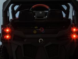 Rear view of a black 12V Junior Sport Utility Ride On Buggy, resembling a rugged SUV. It features bright red taillights, large tires, and a visible steering wheel. The model number NV-H301 is on the rear license plate.