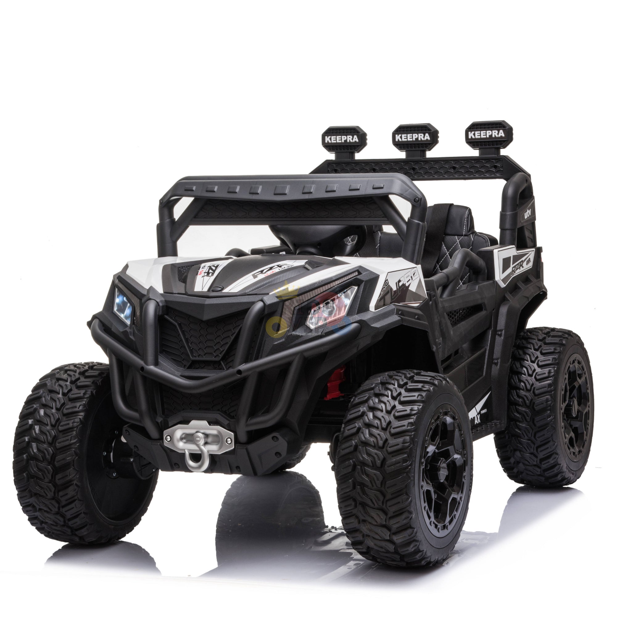 The Upgraded 12V Junior Sport Utility Ride On Buggy/UTV 4WD Edition features black and white design, large rugged tires, a roll cage, decorative lights, and branding. This ATV-style ride-on includes a parental remote for safety and added fun.