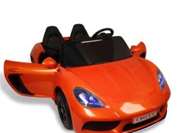 Experience excitement with the Orange 24V XXL SuperSport Ride On Car, featuring blue headlights, a sleek black interior, and one door open to reveal the steering wheel. Equipped with realistic air-filled tires and a T-911 T-T license plate for an authentic touch.